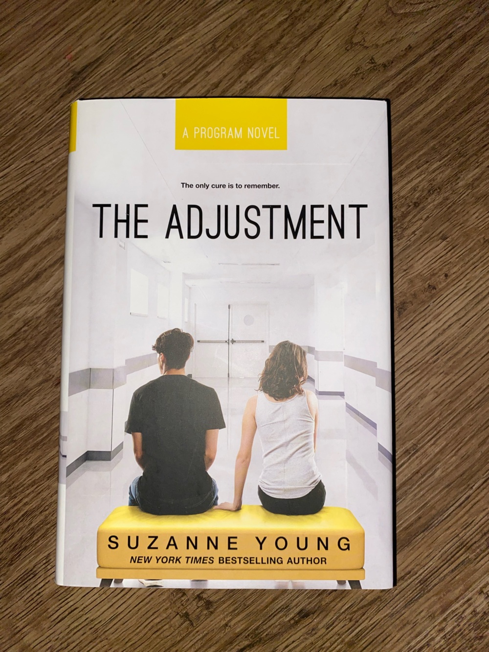 The Adjustment by Suzanne Young - White & Yellow Hardcover Novel